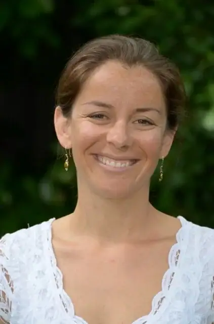 Judy Wong, Ph.D., anxiety specialist at Pacific Anxiety Group, smiling outdoors.