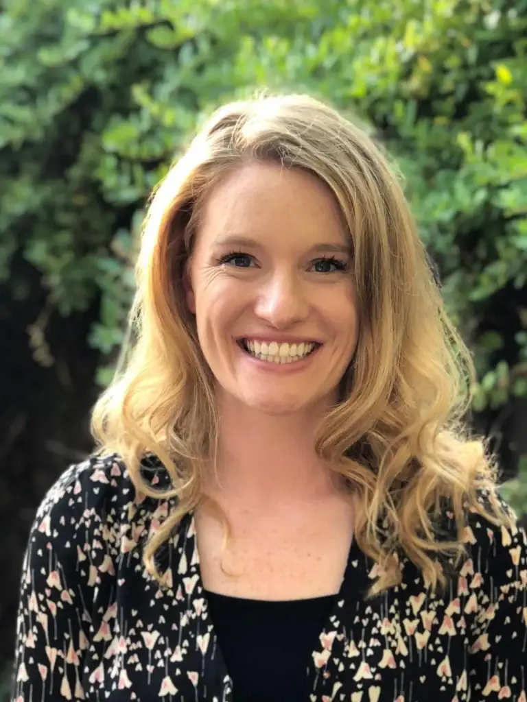 Portrait of a smiling woman, mental health expert at Pacific Anxiety Group.