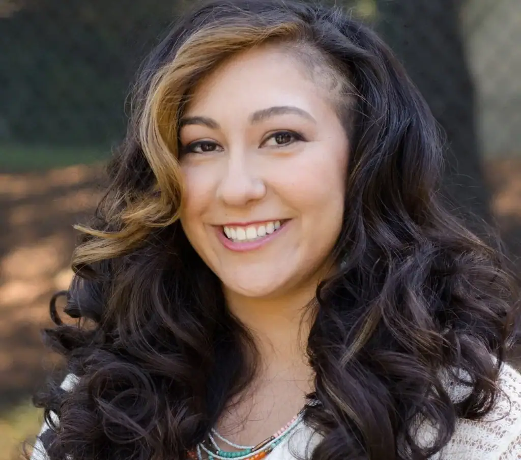 Portrait of Zlatena Theodore Psy.D., therapist at Pacific Anxiety Group, smiling outdoors.
