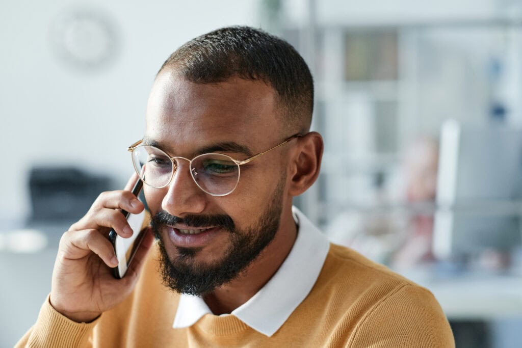 Man talking on phone, seeking anxiety help at Pacific Anxiety Group.
