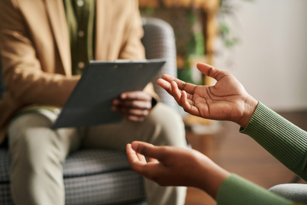 Woman talking to her therapist about what are cbt exercises for adhd.